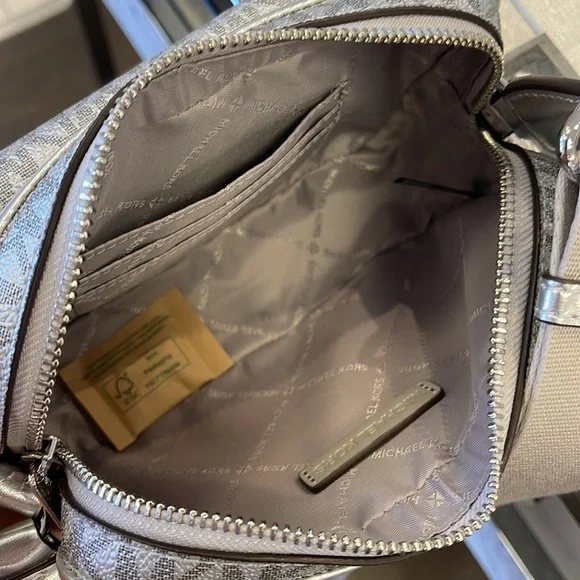 Michael Kors Bradshaw Extra-Sm Metallic Signature Logo Camera Crossbody
Silver - Picture 9 of 16